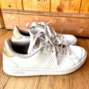 White Adidas Stan Smith sneakers w/ gold accent